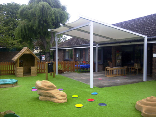  A tensile fabric freestanding single pitch canopy with built-in gutter