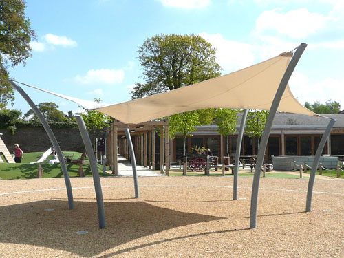  A tensile fabric hypar canopy with curved tubular steel posts