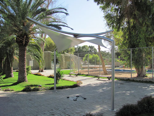  A tensile fabric hypar canopy within two opposed curved arches