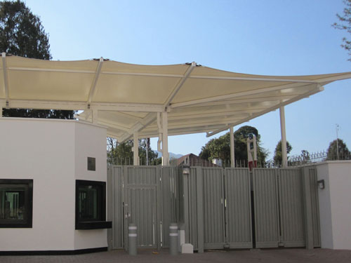  A freestanding double inverted pitch canopy with built-in gutter