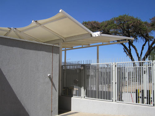  A freestanding double inverted pitch canopy with built-in gutter