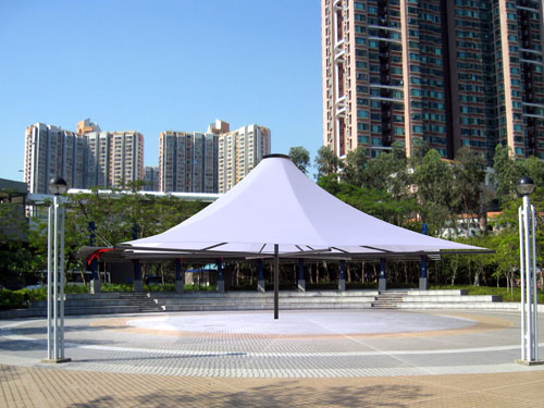  A tensile fabric square coned umbrella with a tubular steel column
