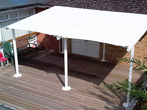  A tensile fabric lean-to canopy with tubular steel frame