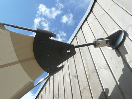  A tensile fabric hypar canopy attached to a wall 